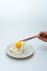 Half-boiled fried egg in a bowl