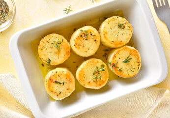 Fondant potatoes in baking dish