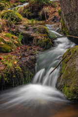 Fototapeta premium Cerveny creek with Cerveny waterfall in Jizerske mountains in spring morning