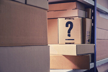 Question mark on a cardboard box, marking. Problems with labeling boxes in the warehouse and...