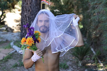 Proud gender fluid man representing diversity in bridal shoot 