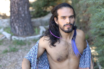 Beautiful long haired dancer showing muscular torso