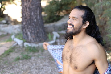 Beautiful long haired dancer showing muscular torso