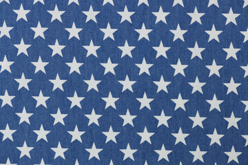 Blue fabric with white stars texture background closeup