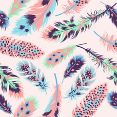 Seamless pattern of ethnic bright feathers. Vector illustration in boho style. Bohemian background from tribal repeating elements. Template for fabric in oriental style. © Artfurskaty