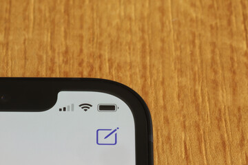 status-bar of a smartphone on wooden background