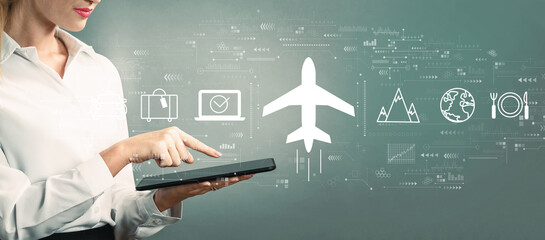 Flight ticket booking concept with business woman using a tablet computer