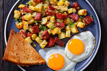 Corned Beef Hash Browns with fried eggs, top view - obrazy, fototapety, plakaty