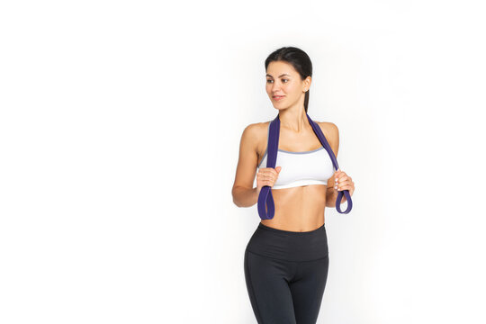 motivated awesome slim woman exercising fitness resistance bands, full length side view photo.