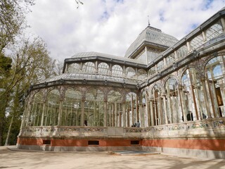 Fototapeta na wymiar Crystal Palace, Palacio de Cristal, in Retiro Park. Madrid, Spain.