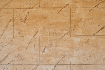 plaster on the wall imitating tiles