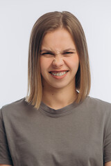 portrait of a young beautiful girl with braces, on a white background