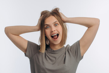 portrait of a young beautiful girl with braces, on a white background