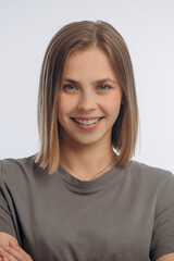portrait of a young beautiful girl with braces, on a white background