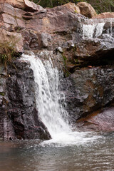 Obraz premium The small but beautiful waterfall Urubu inside the city limits of Brasilia, Brazil