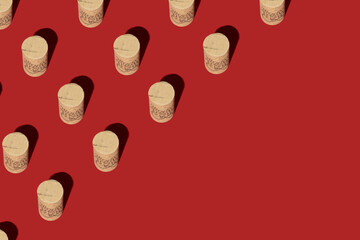 Seamless pattern made of wine corks on red background. Isometric view. Wine drinking culture concept. Apperetes and survivors. Copy space.