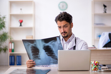 Young male doctor radiologist working in the clinic