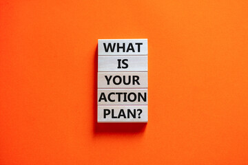 Action plan symbol. Concept words What is your action plan on wooden blocks. Beautiful orange table orange background. Business What is your action plan concept. Copy space.