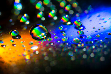 Water drops on the surface of a CD. Abstract Effect, Rainbow Colors