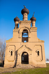 Old ruined church. Bent crosses and broken walls of the temple, ancient forged frames on the windows. Christian monastery.