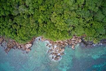 Drone field of view of sea and coastline with natural background forming patterns in nature, Praslin Island, Seychelles.