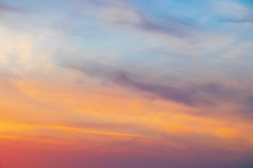 Beautiful sky background at sunset. Colorful, bright clouds in the evening
