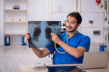 Young male doctor radiologist working in the clinic