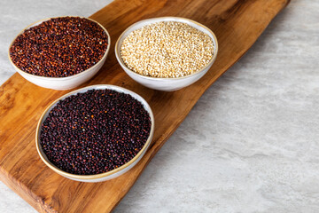 Quinoa of different colors: white, red and black in a bowl. Healthly gluten free grains.
