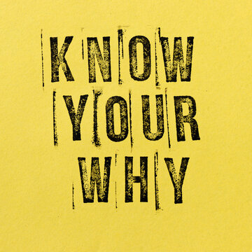 Know Your Why text on yellow paper. Stamp font. Meaningful life concept.