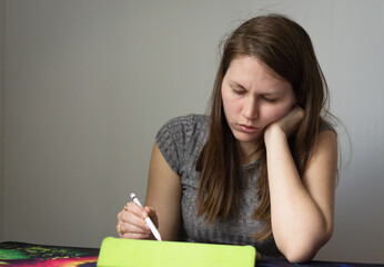 beautiful woman drawing on a digital drawing tablet