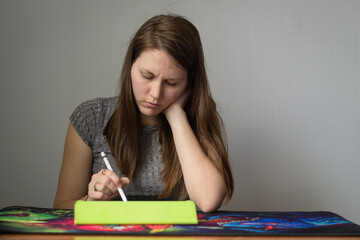 beautiful woman drawing on a digital drawing tablet