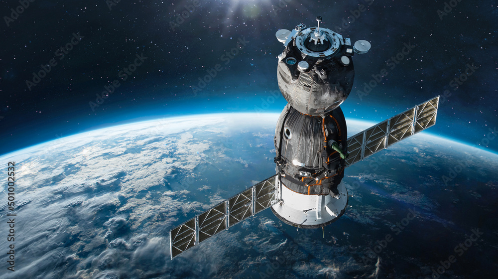 Aufkleber Russian spaceship on orbit of Earth. Sunlight and sky with clouds on background. Spacecraft in outer space. Sci-fi wallpaper. Elements of this image furnished by NASA
