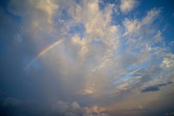 Drone field of view of rainbow in cloudy sky on the paradise island of Mahe, Seychelles.