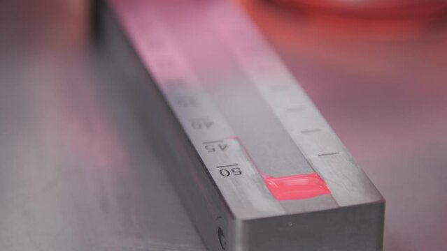 conducting testing for the quality of pink color close-up. Factory of industrial products