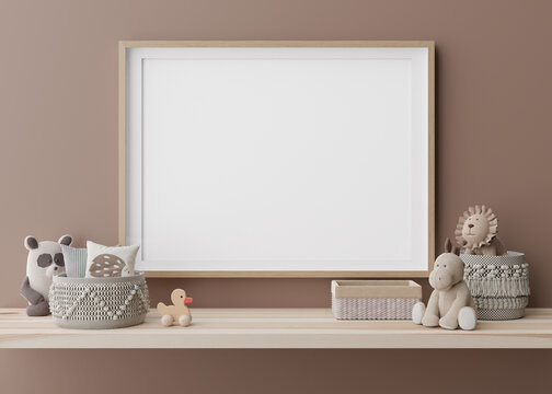 Empty horizontal picture frame hanging on brown wall in modern child room. Mock up interior in contemporary style. Free, copy space for picture. Rattan baskets, plush toys. 3D rendering.