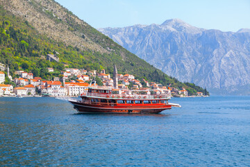 Fototapeta premium Wooden tour boat in Kotor Bay near Perast city in Montenegro