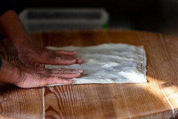A woman making pancakes in Antalya, Turkey. SELECTİVE FOCUS
