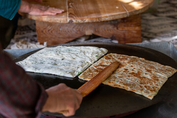 A woman making pancakes in Antalya, Turkey. SELECTİVE FOCUS