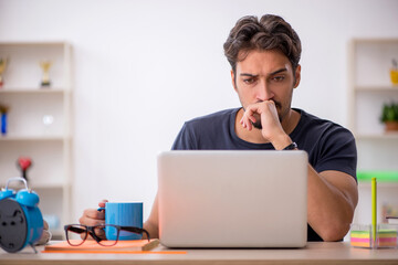 Young male designer working in the office