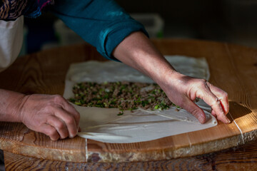 A woman making pancakes in Antalya, Turkey. SELECTİVE FOCUS
