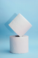 two white toilet papers on a BLUE background