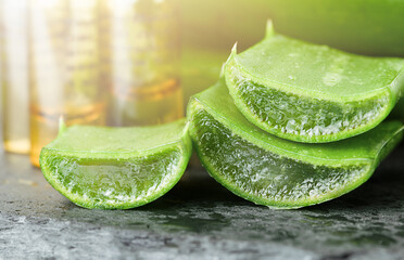 slices of chopped aloe and ampoules with liquid
