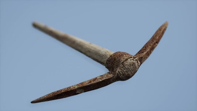 Close up of an old rusted pickaxe head