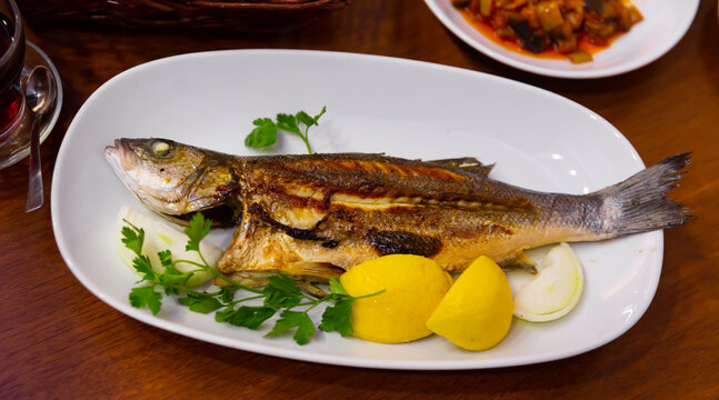 Popular Turkish fish Seabass (Levrek) with lemon. ..