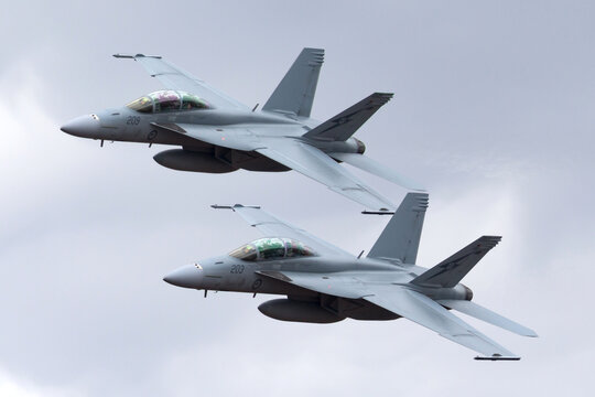Avalon, Australia - February 27, 2013: Two Royal Australian Air Force (RAAF) Boeing F/A-18F Super Hornet multirole fighter aircraft flying in formation.
