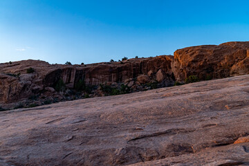 Sunset at Arches National Park over the mountain that leads to the Delicate Arch