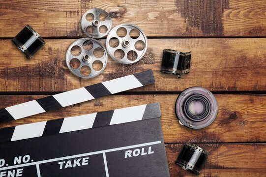 Film clapperboard, vintage camera and photo. Concept of entertainment industry worldwide award