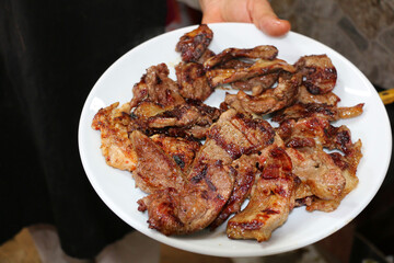 Meat prepared from lambs raised in the highlands of Turkey is barbecued.