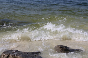 Waves Splashing Against Shore Rocks.  