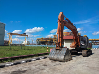 Malaysia, 23 April 2022: Hitachi orange escavator located in the factory area.